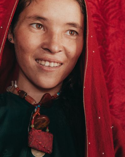 A Hazara woman poses for a photo in her family home in Afghanistan. [Image by IMB]
