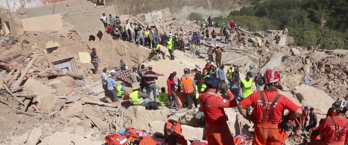 Crews and locals search through the earthquake impact in Imi N'Tala