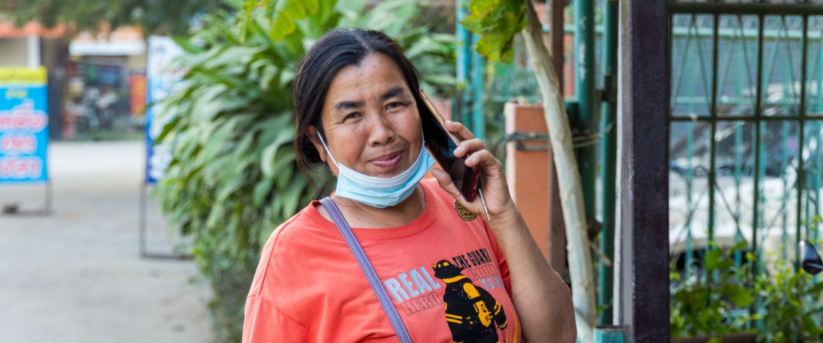 A Thai woman talks on the phone in Thailand. 