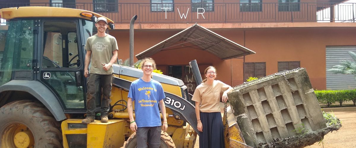 Former TWR Interns (from left to right) Anthony Mirabella, Austin Mitchell and Zoe Schmidt help do some heavy lifting at our transmitter site in West Africa during their summer internships. [Image courtesy of Austin Mitchell] 